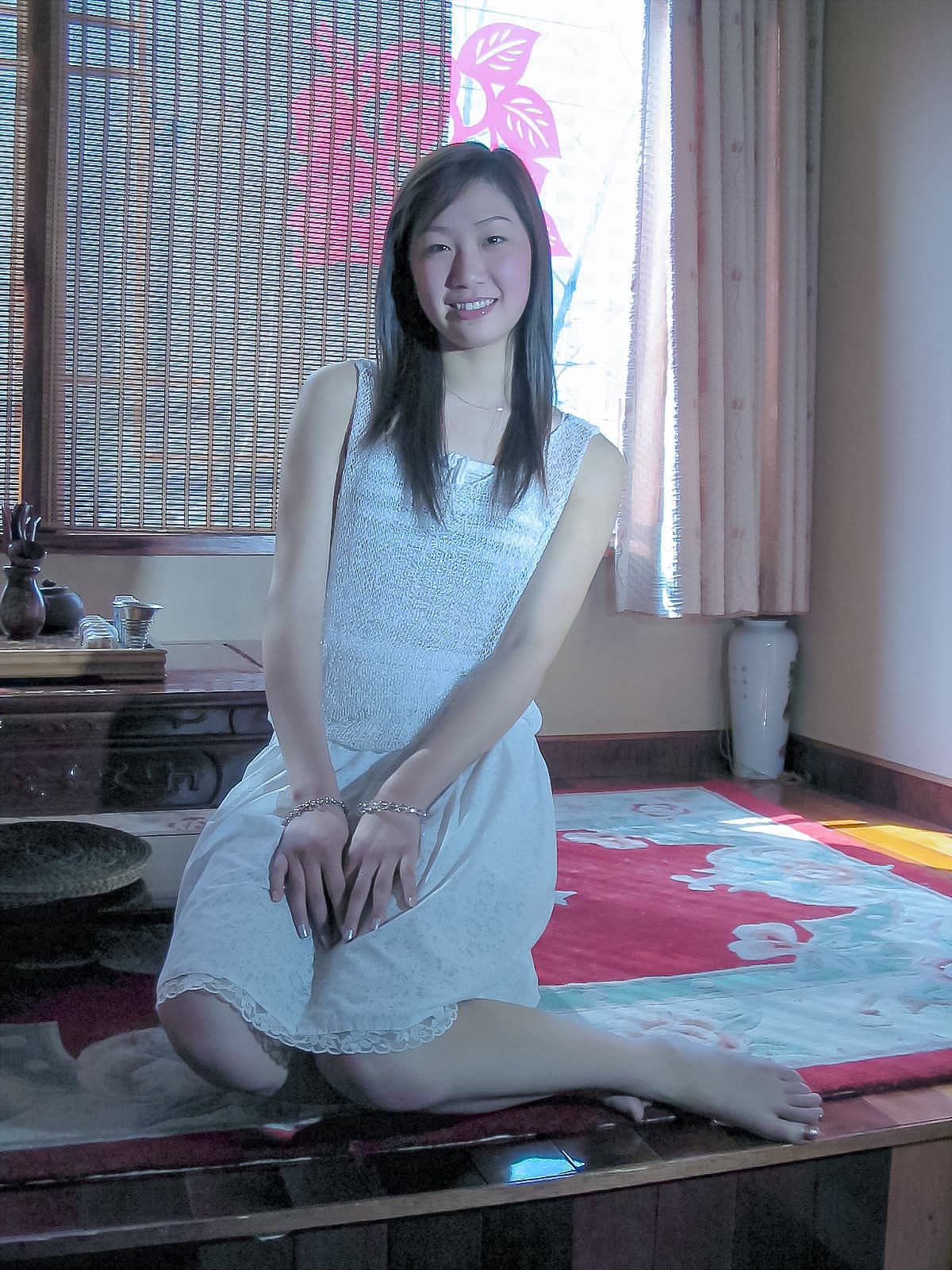 Close-up of silky instep and heel in soft light, hosiery texture and delicate toe line visible